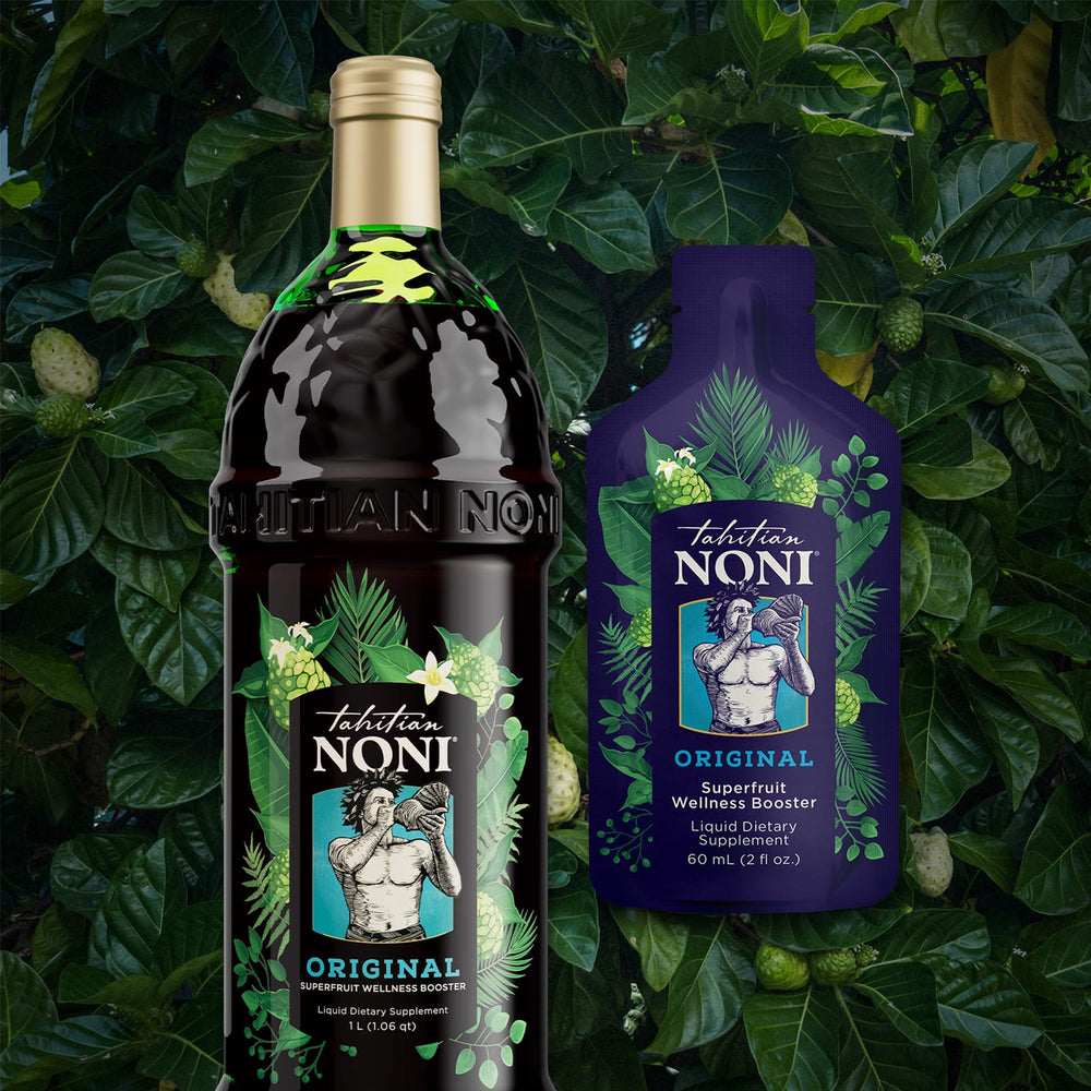 Tahitian Noni ORIGINAL bottle and sachet on green leaves